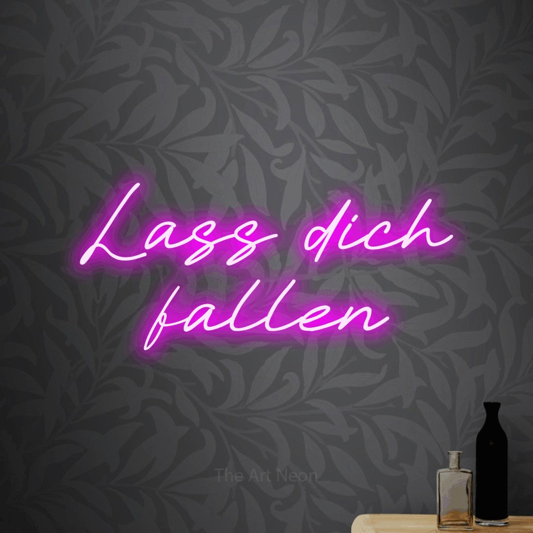 LED neon sign reading “Lass dich fallen”, arranged in 2 lines.