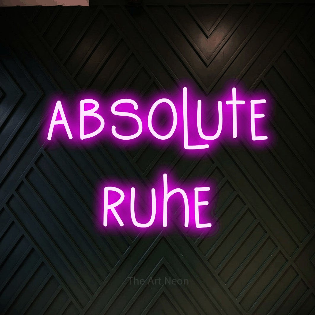 LED neon sign reading “absolute ruhe”, arranged in 2 lines.