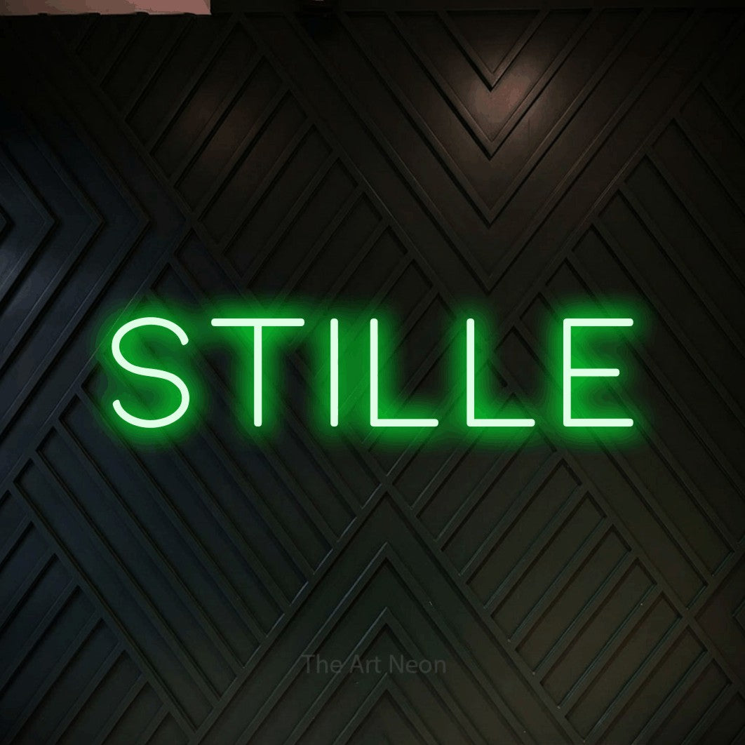 LED neon sign reading “STILLE”, arranged in a single line.