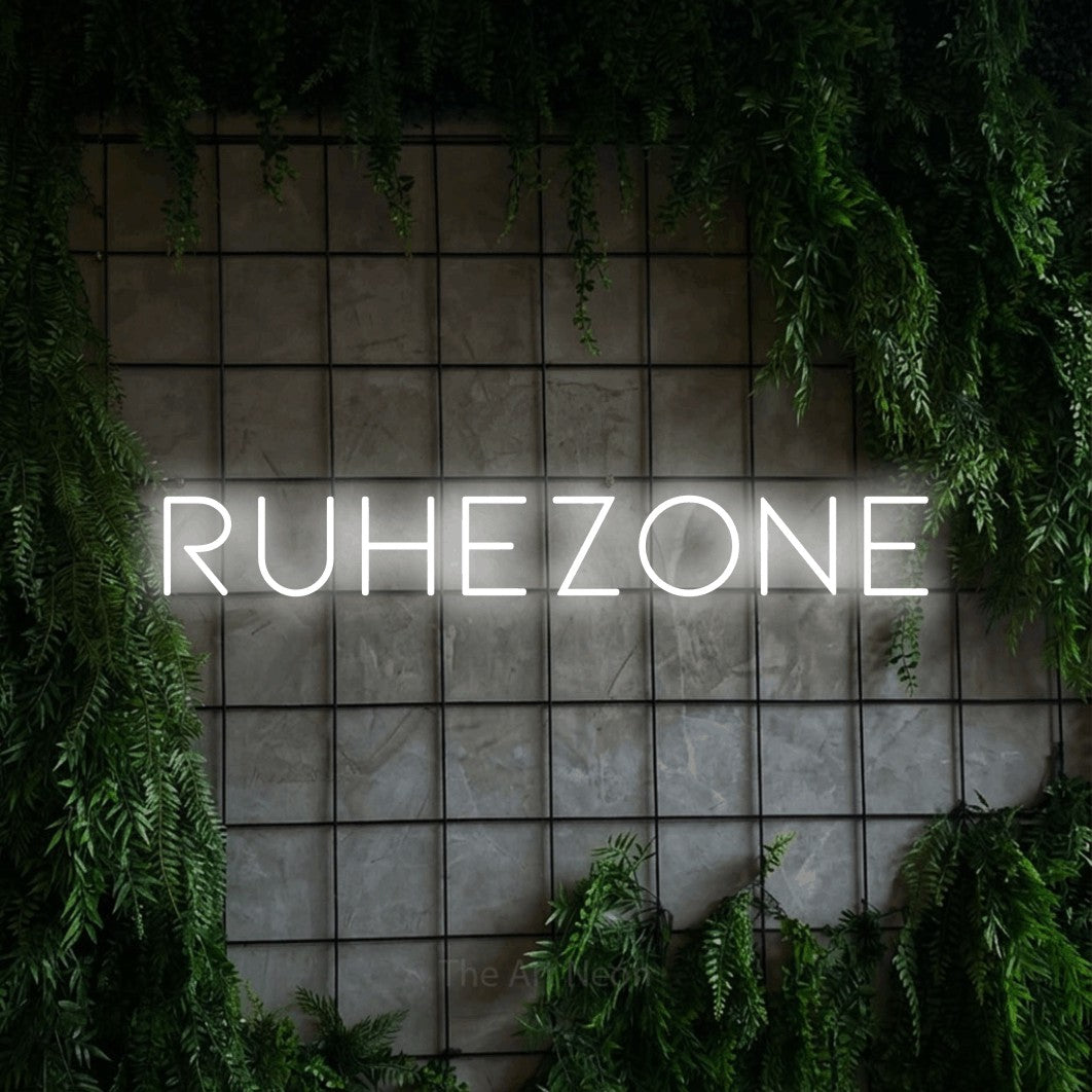LED neon sign reading “RUHEZONE”, arranged in a single line.