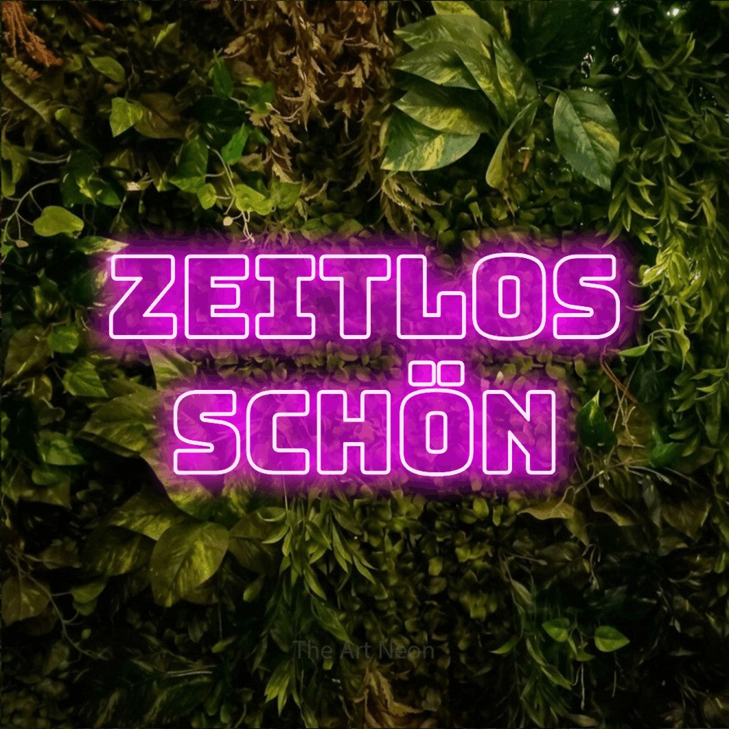 LED neon sign reading “zeitlos schön”, arranged in 2 lines.