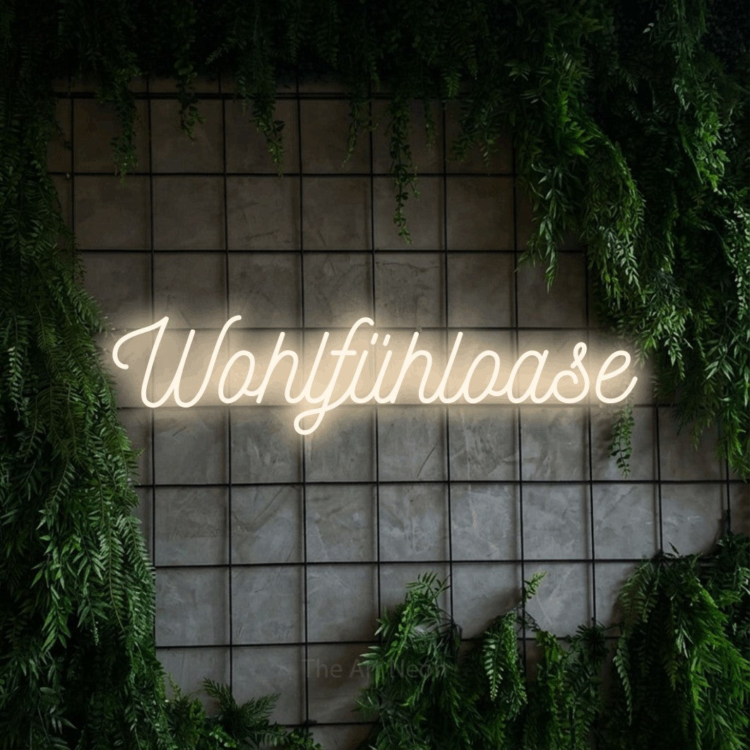 LED neon sign reading “Wohlfühloase”, arranged in a single line.