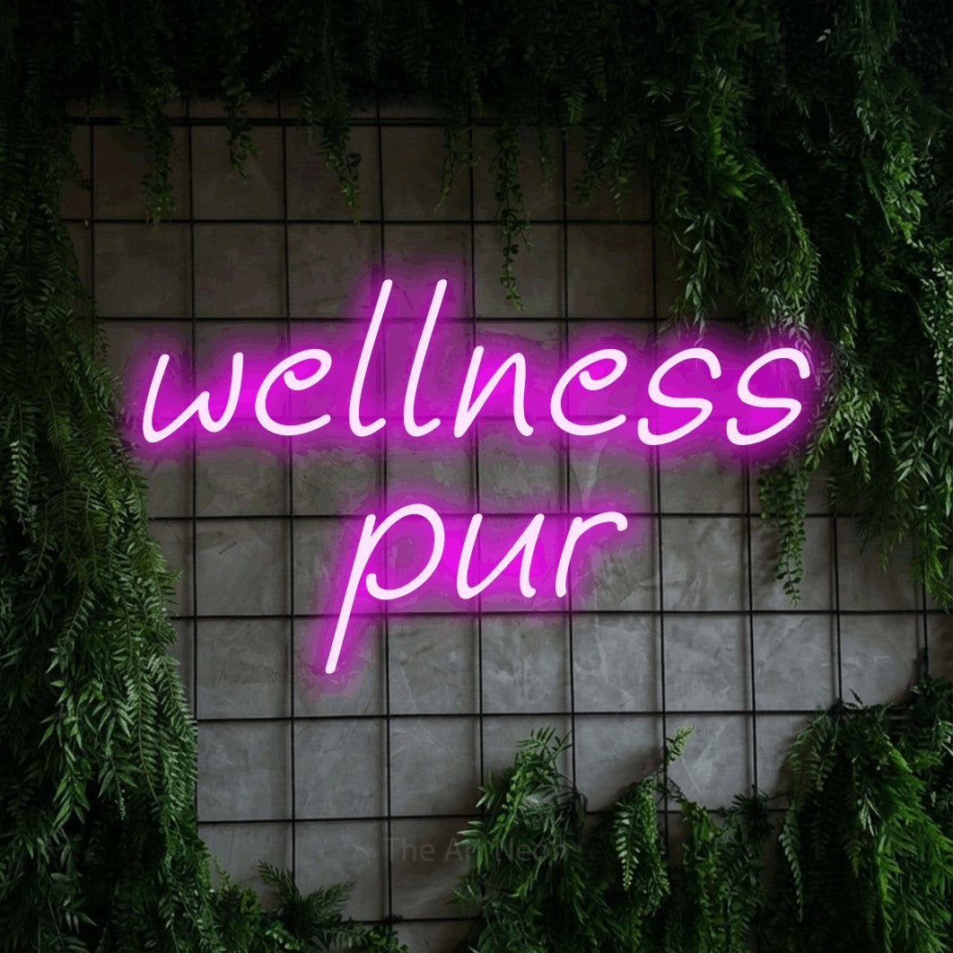 LED neon sign reading “wellness pur”, arranged in 2 lines.