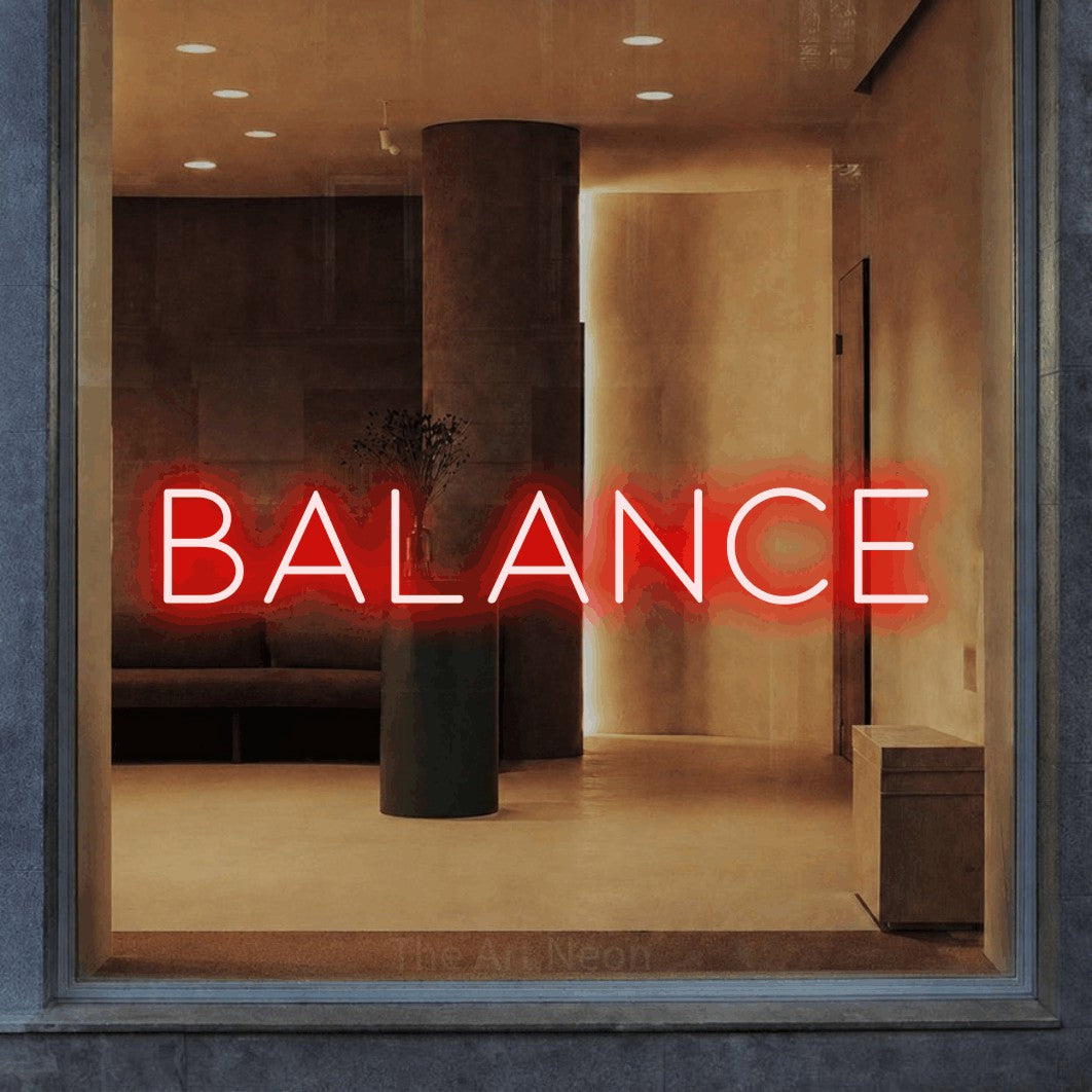 LED neon sign reading “Balance”, arranged in a single line.