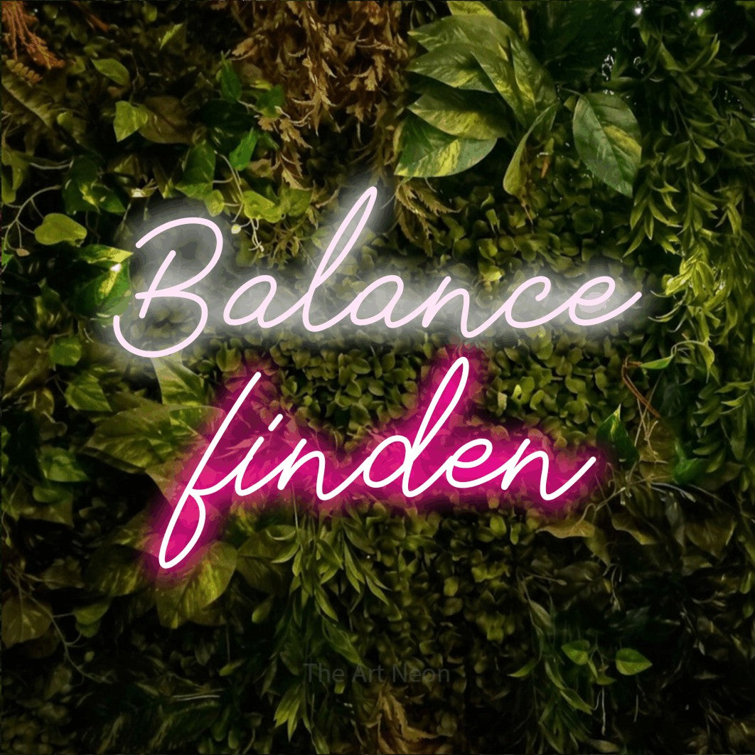 LED neon sign reading “Balance finden”, arranged in 2 lines.