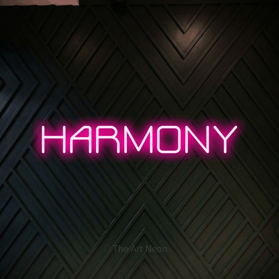 LED neon sign reading “HARMONY”, arranged in a single line.