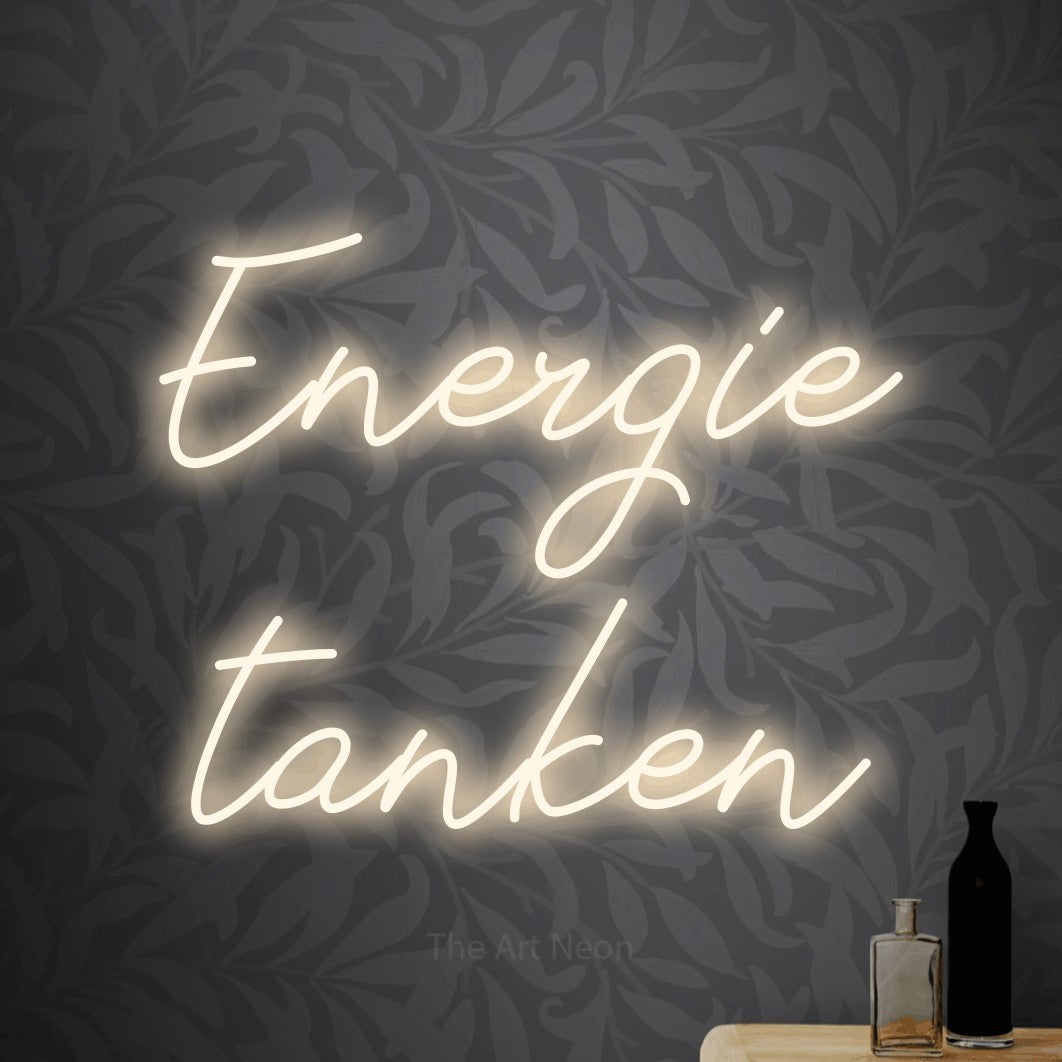LED neon sign reading “Energie tanken”, arranged in 2 lines.