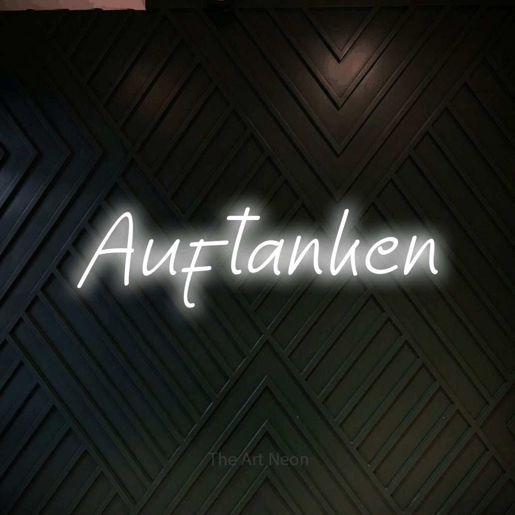 LED neon sign reading “Auftanken”, arranged in a single line.