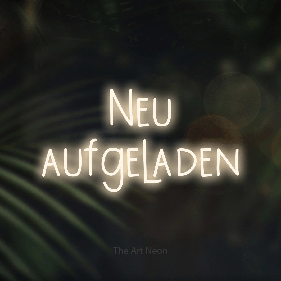 LED neon sign reading “Neu aufgeladen”, arranged in 2 lines.