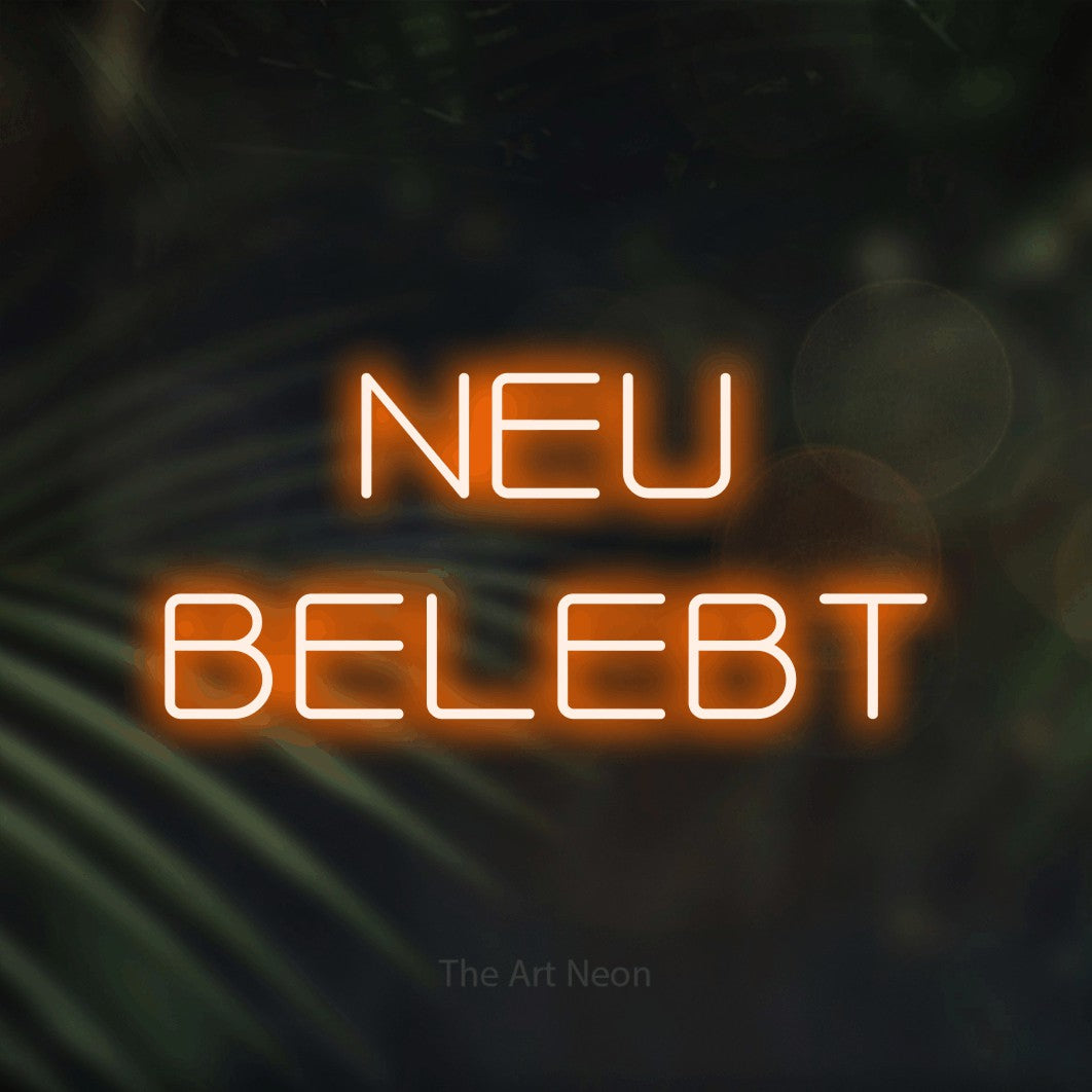 LED neon sign reading “NEU BELEBT”, arranged in 2 lines.