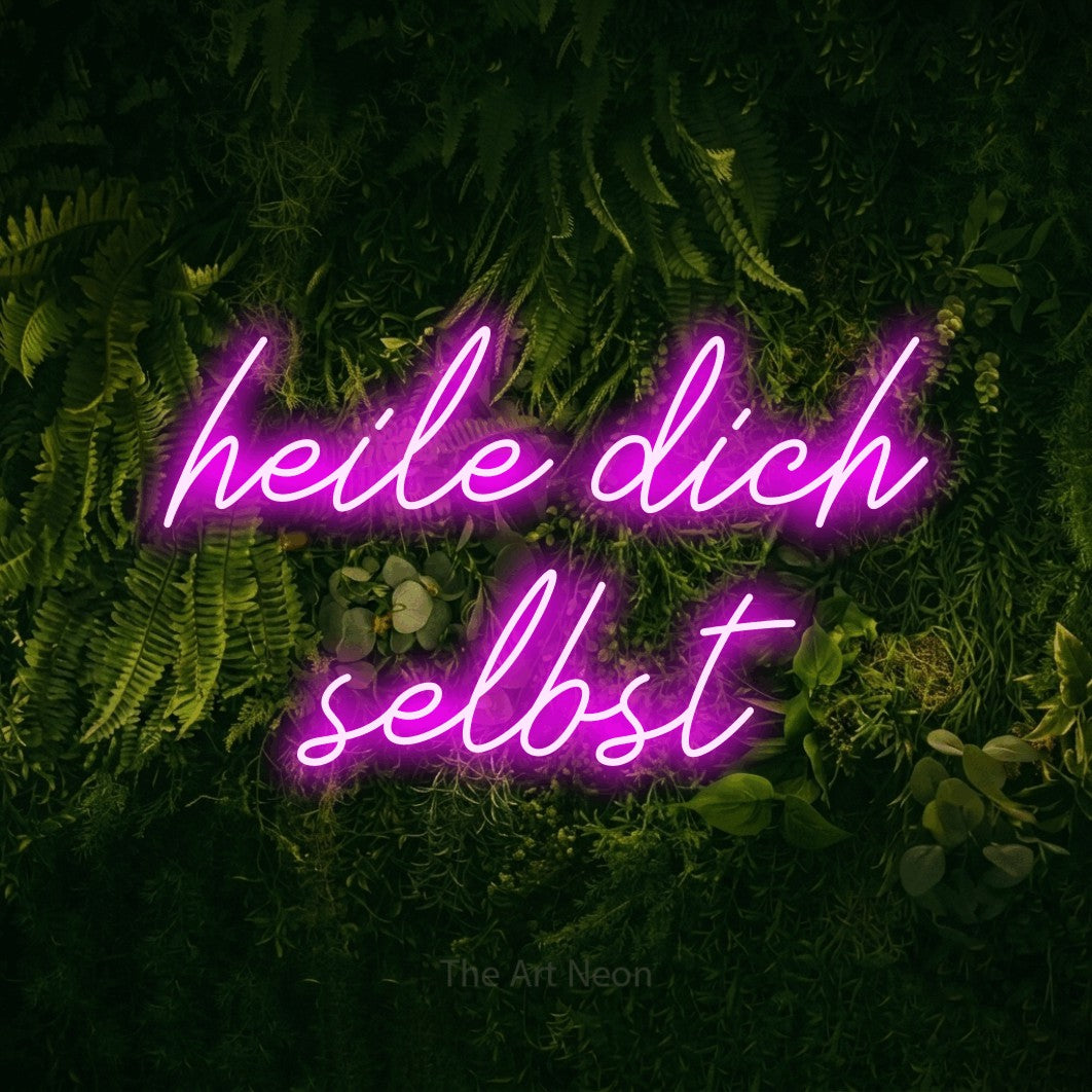 LED neon sign reading “heile dich selbst”, arranged in 2 lines.