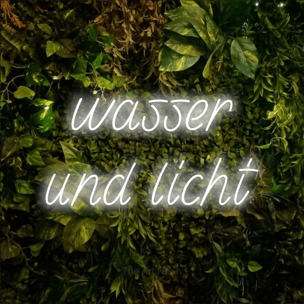 LED neon sign reading “wasser und licht”, arranged in 2 lines.