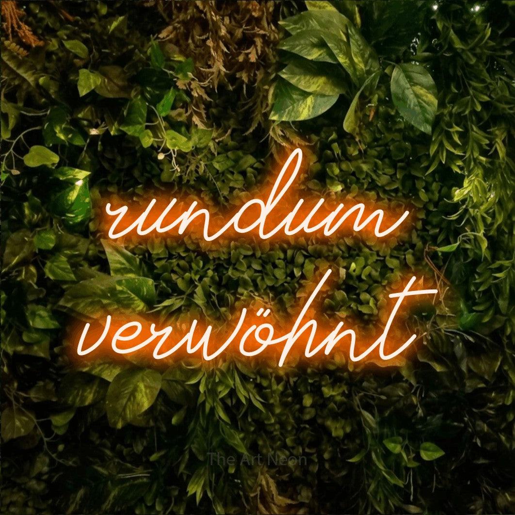 LED neon sign reading “rundum verwöhnt”, arranged in 2 lines.
