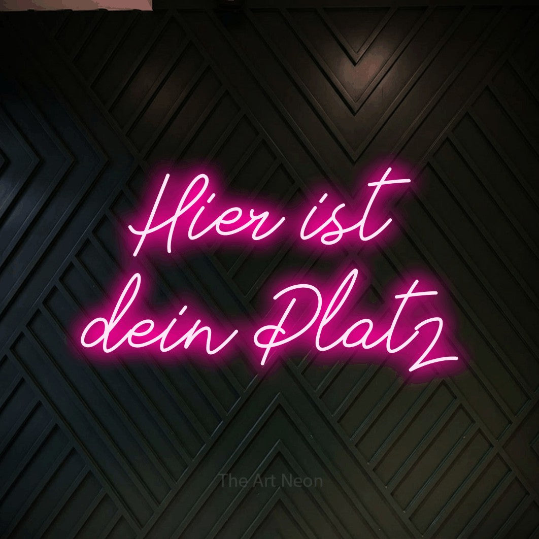 LED neon sign reading “Hier ist dein Platz”, arranged in 2 lines.