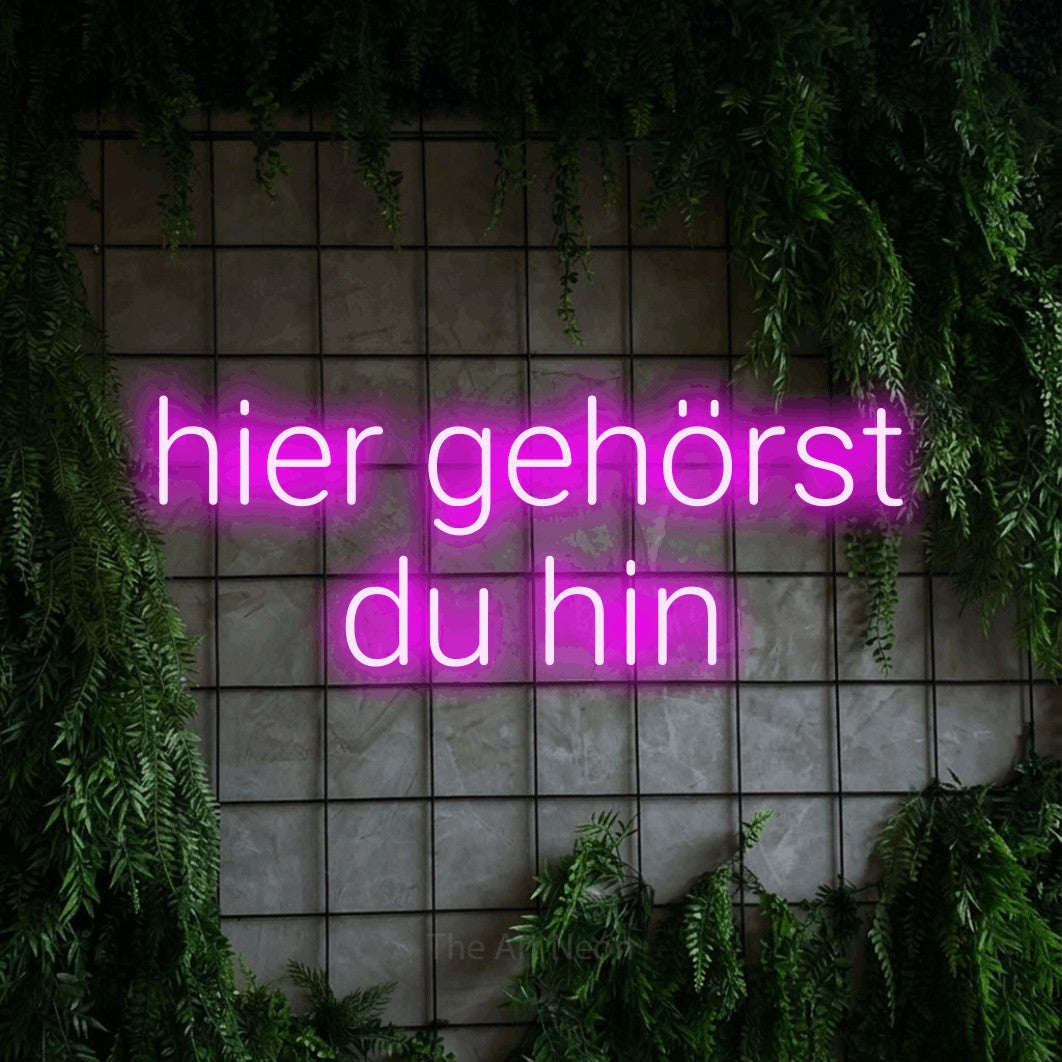 LED neon sign reading “hier gehörst du hin”, arranged in 2 lines.