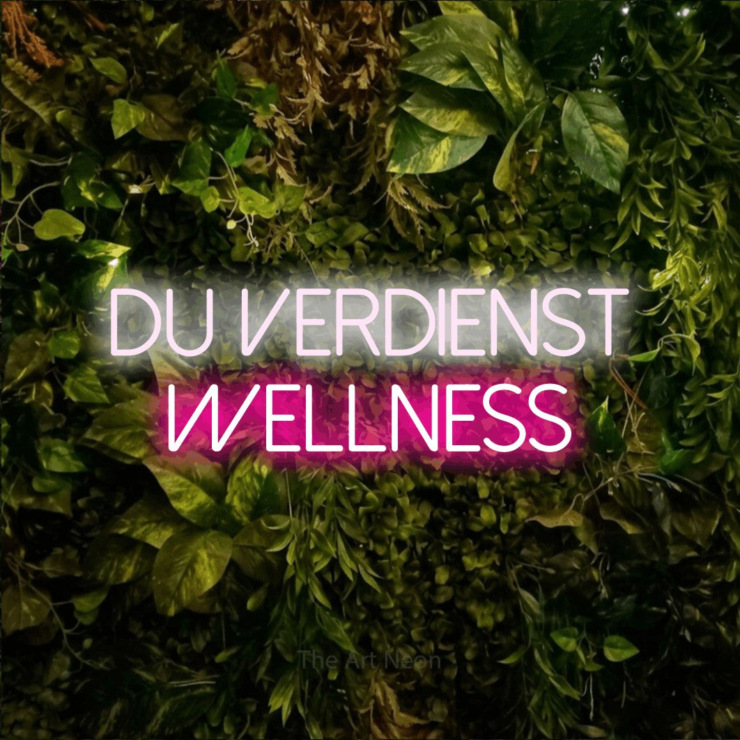 LED neon sign reading “Du verdienst Wellness”, arranged in 2 lines.