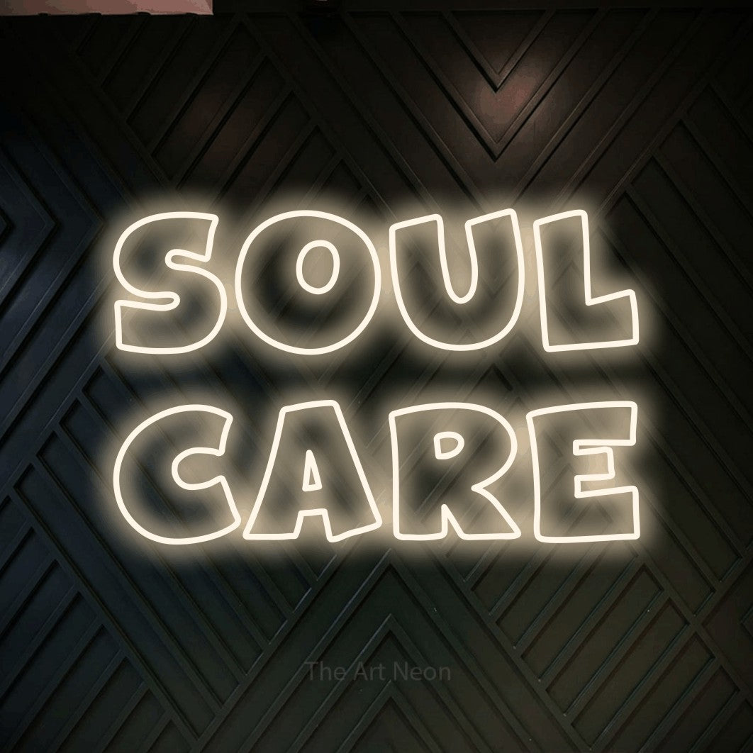LED neon sign reading “SOUL CARE”, arranged in 2 lines.