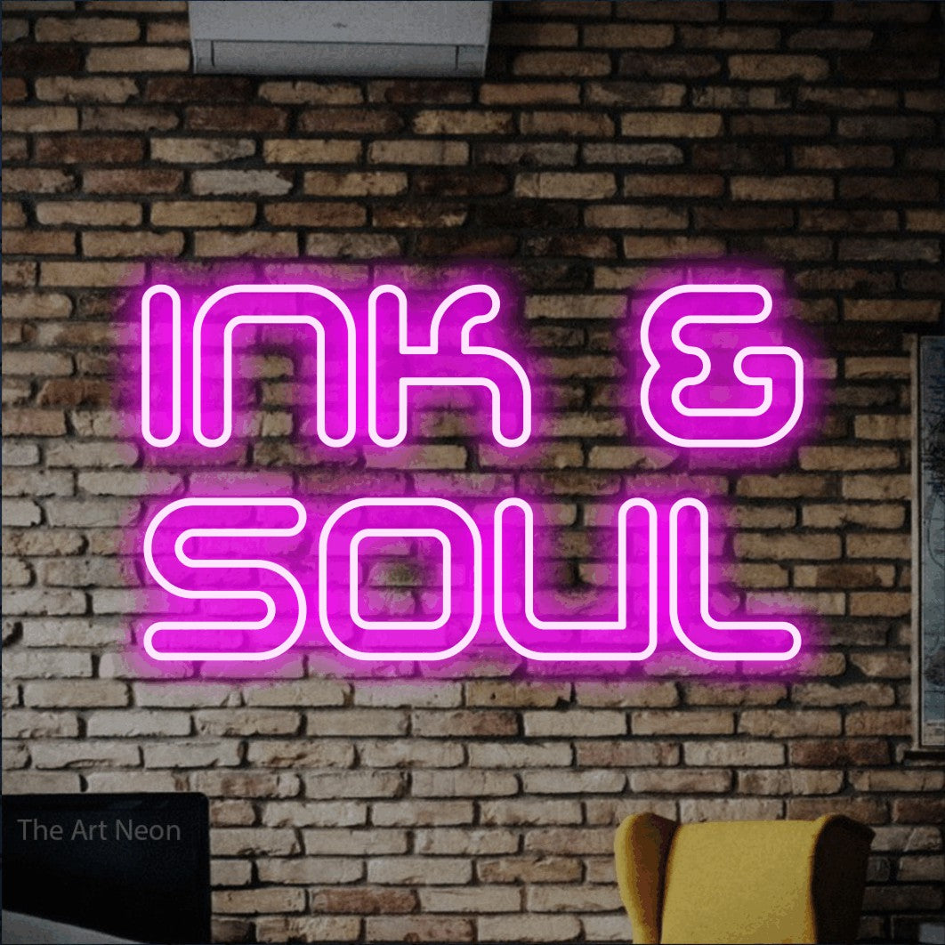 LED neon sign reading “Ink & Soul”, arranged in 2 lines.