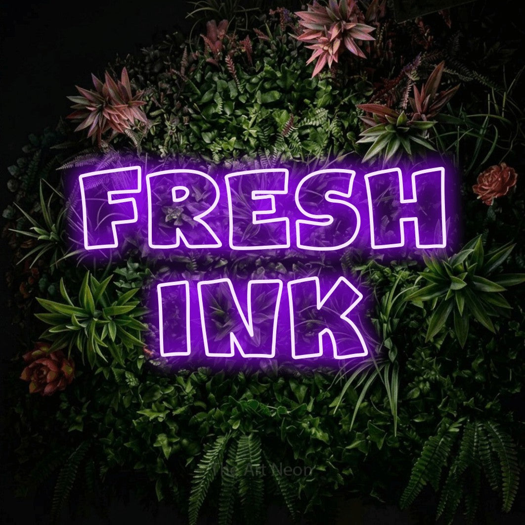 LED neon sign reading “Fresh Ink”, arranged in 2 lines.