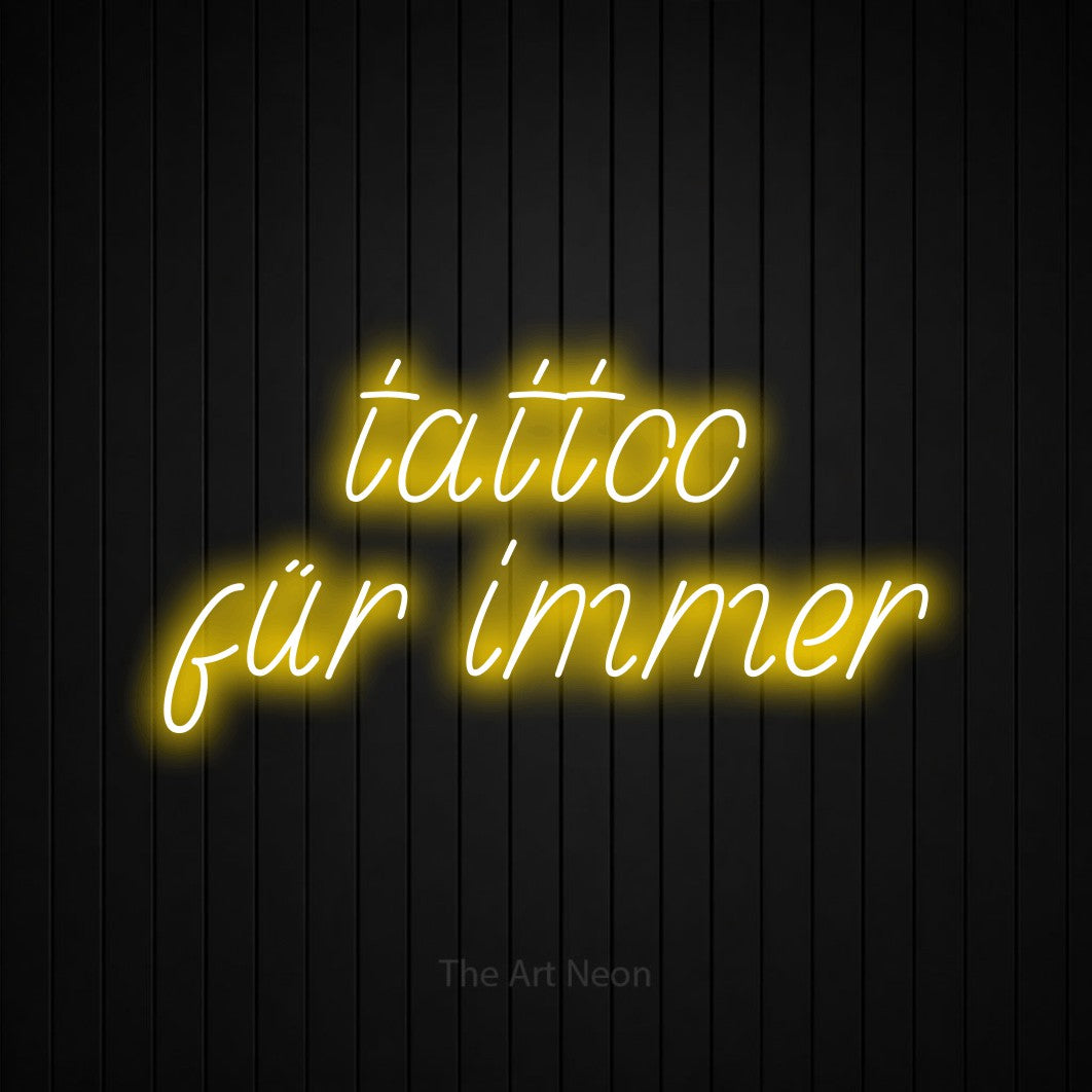 LED neon sign reading “tattoo für immer”, arranged in 2 lines.