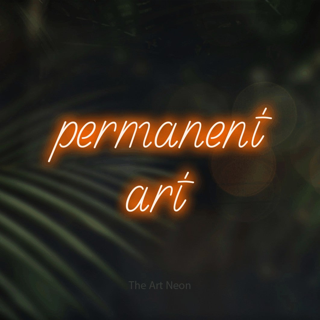 LED neon sign reading “permanent art”, arranged in 2 lines.