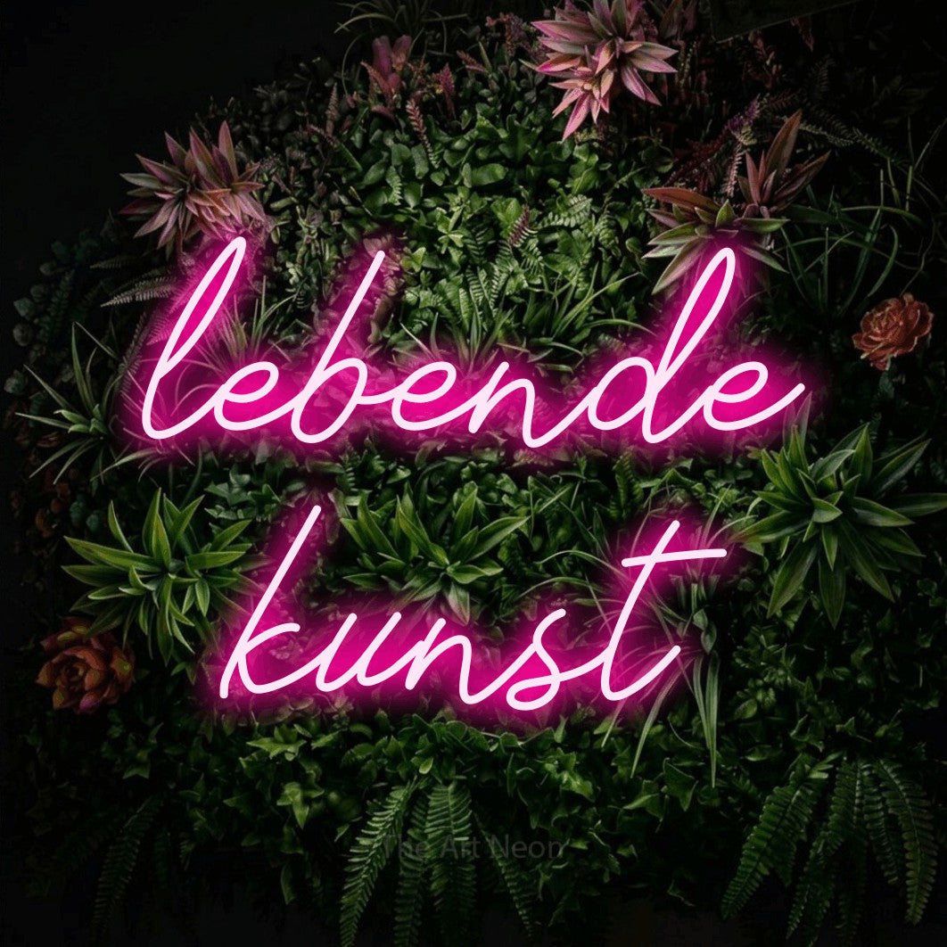 LED neon sign reading “lebende kunst”, arranged in 2 lines.