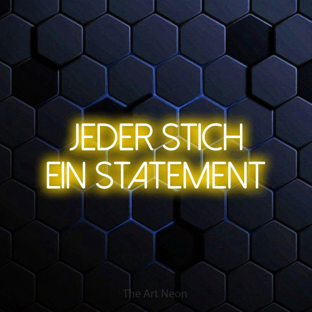 LED neon sign reading “JEDER STICH EIN STATEMENT”, arranged in 2 lines.