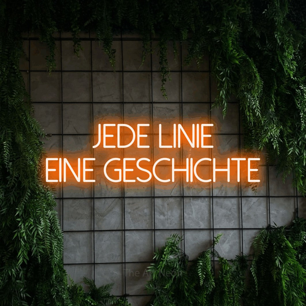 LED neon sign reading “jede linie eine geschichte”, arranged in 2 lines.