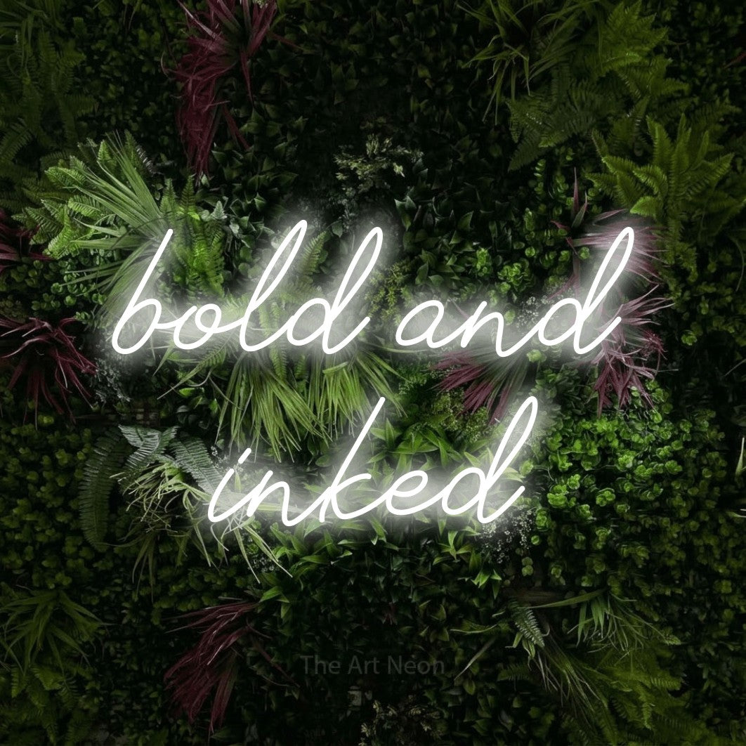 LED neon sign reading “bold and inked”, arranged in 2 lines.