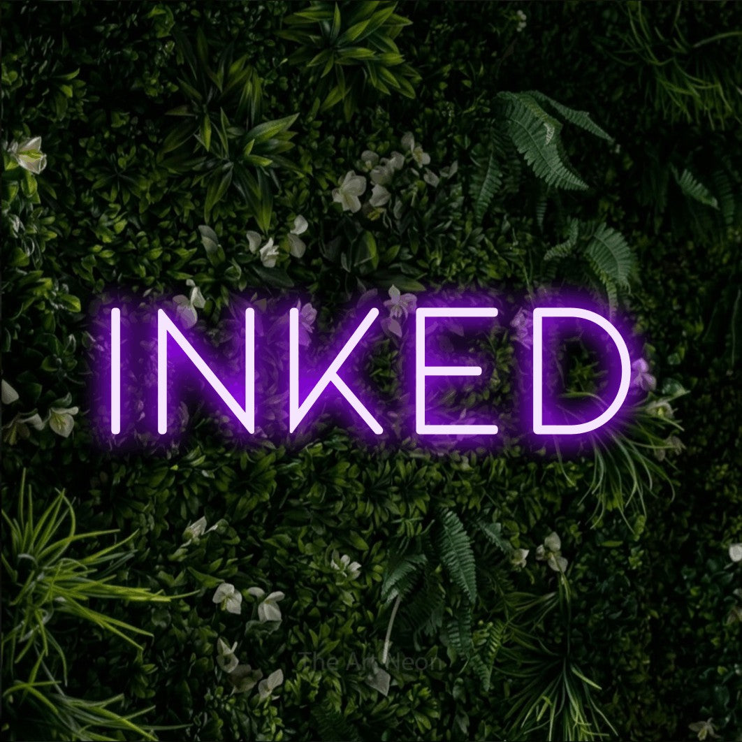 LED neon sign reading “inked”, arranged in a single line.