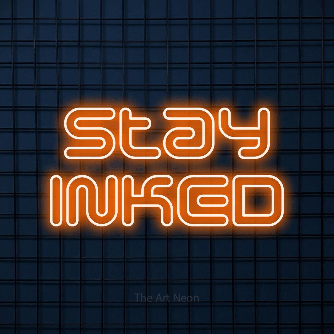 LED neon sign reading “stay INKED”, arranged in 2 lines.