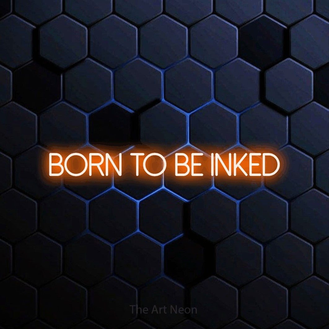 LED neon sign reading “born to be inked”, arranged in a single line.