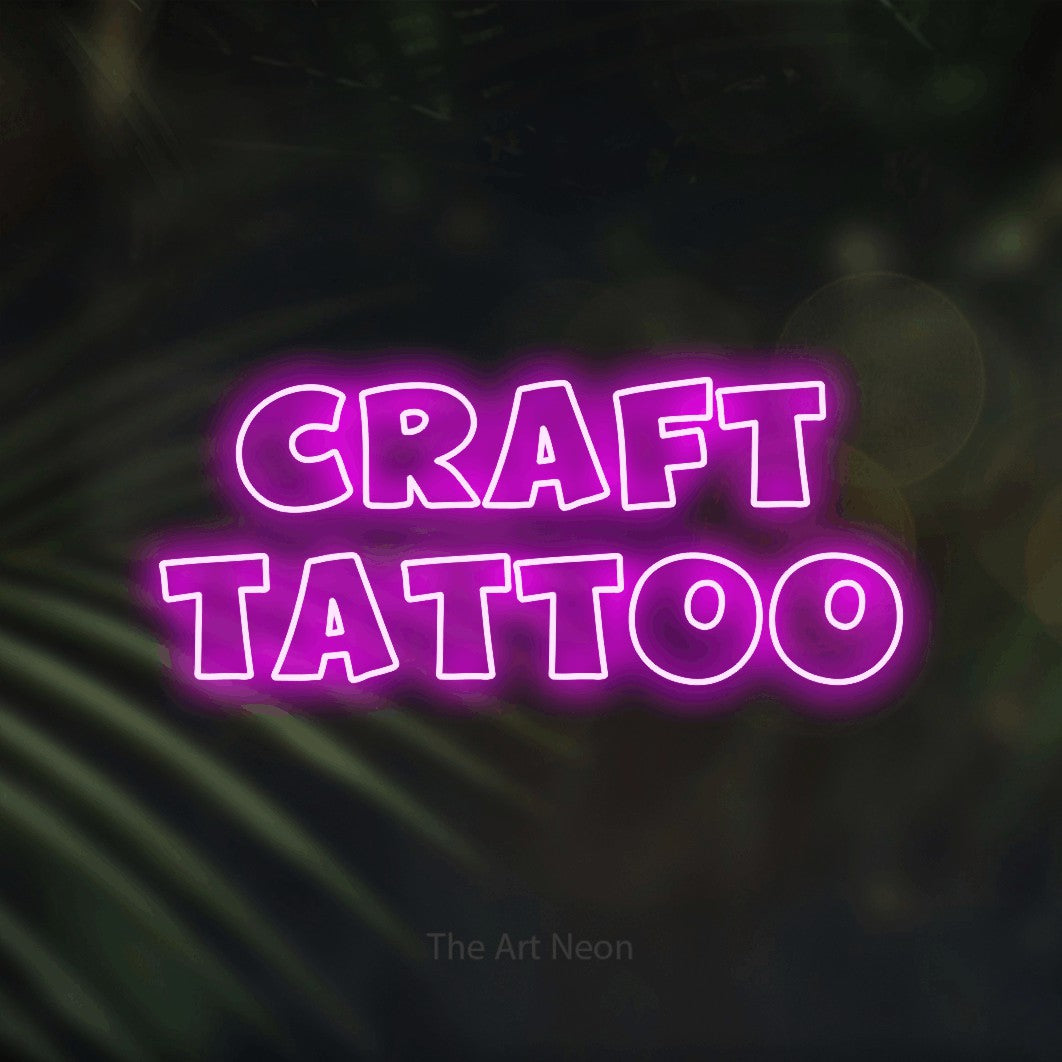 LED neon sign reading “craft tattoo”, arranged in 2 lines.