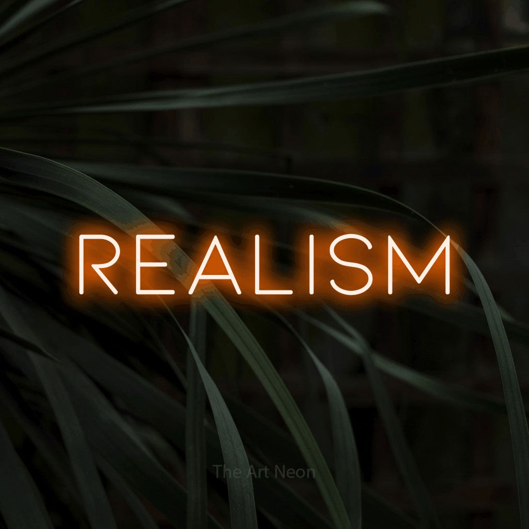 LED neon sign reading “REALISM”, arranged in a single line.