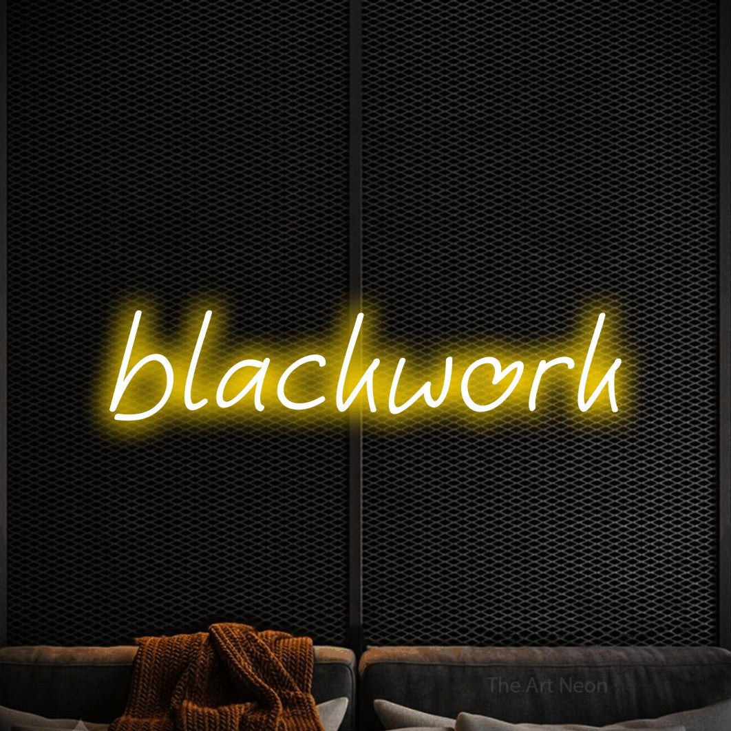 LED neon sign reading “blackwork”, arranged in a single line.