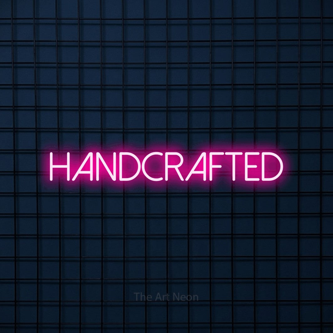 LED neon sign reading “handcrafted”, arranged in a single line.