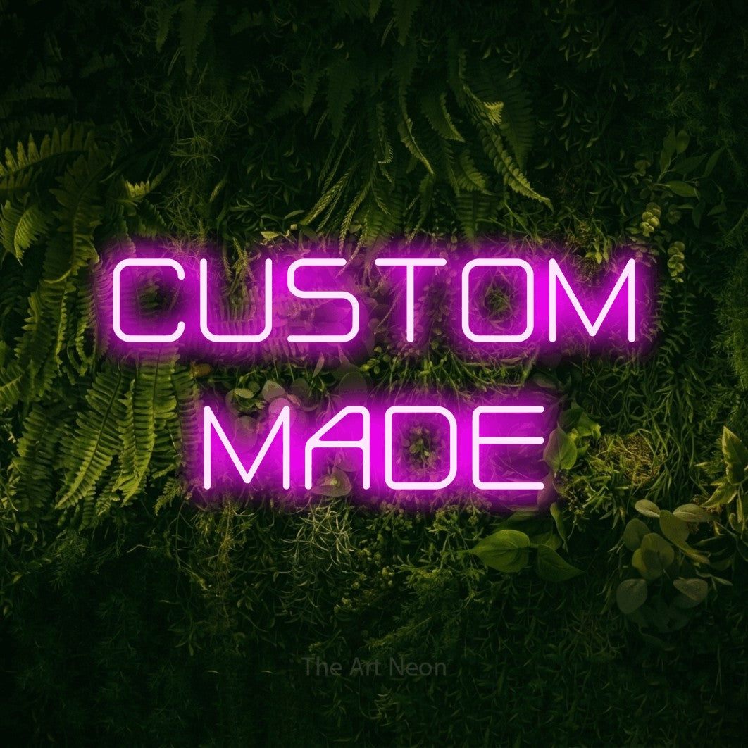 LED neon sign reading “CUSTOM MADE”, arranged in 2 lines.