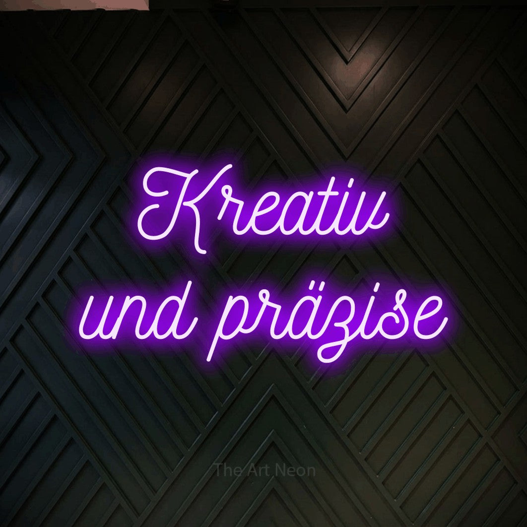 LED neon sign reading “Kreativ und präzise”, arranged in 2 lines.