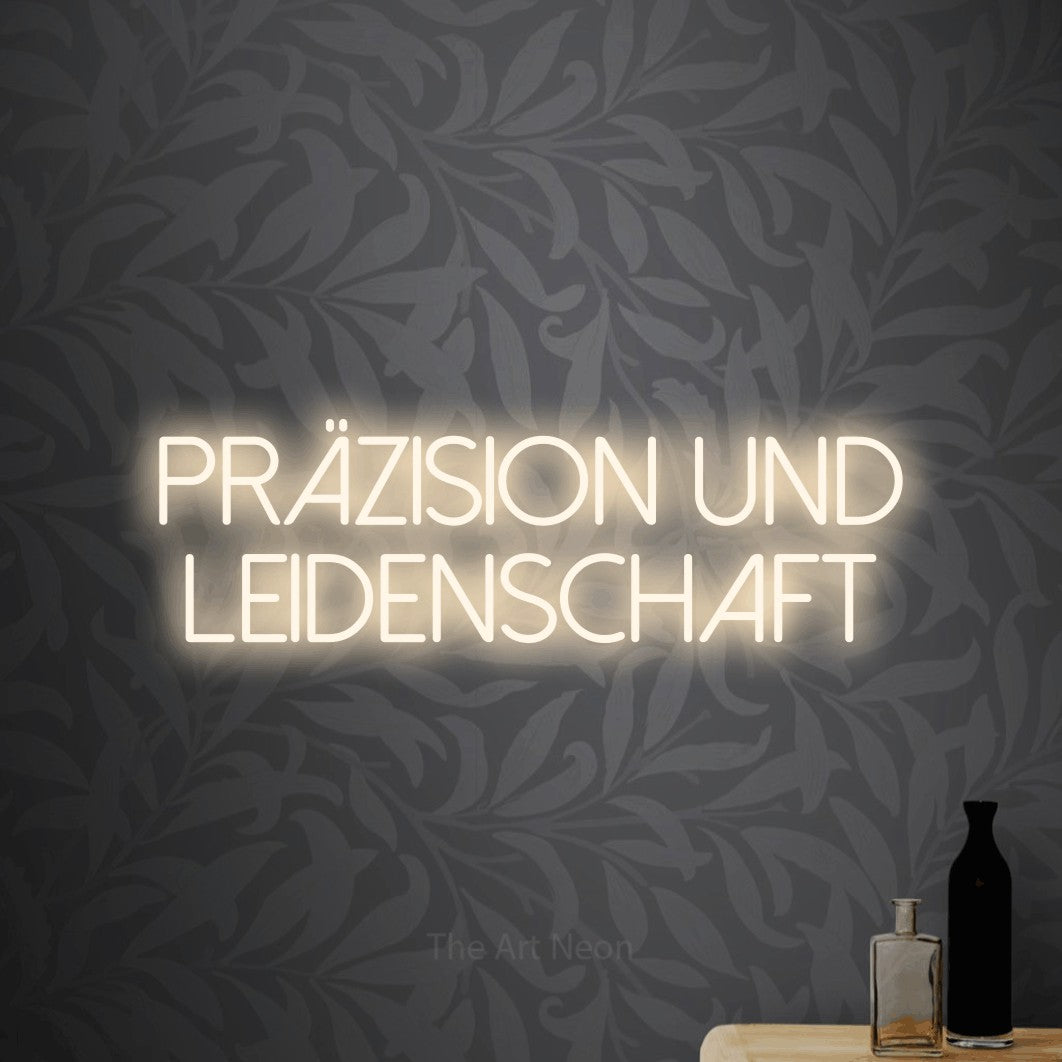 LED neon sign reading “PRÄZISION UND LEIDENSCHAFT”, arranged in 2 lines.