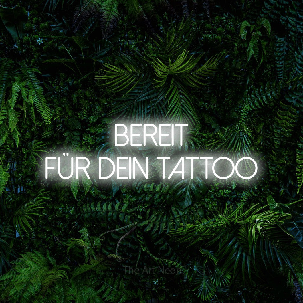 LED neon sign reading “bereit für dein tattoo”, arranged in 2 lines.