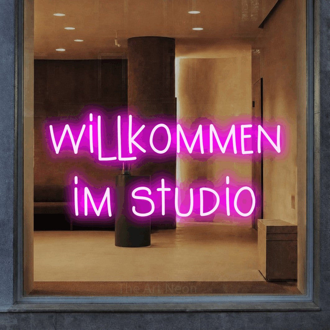 LED neon sign reading “willkommen im studio”, arranged in 2 lines.