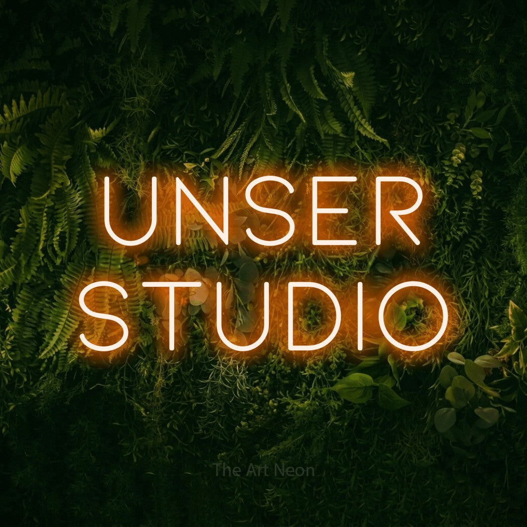 LED neon sign reading “Unser Studio”, arranged in 2 lines.