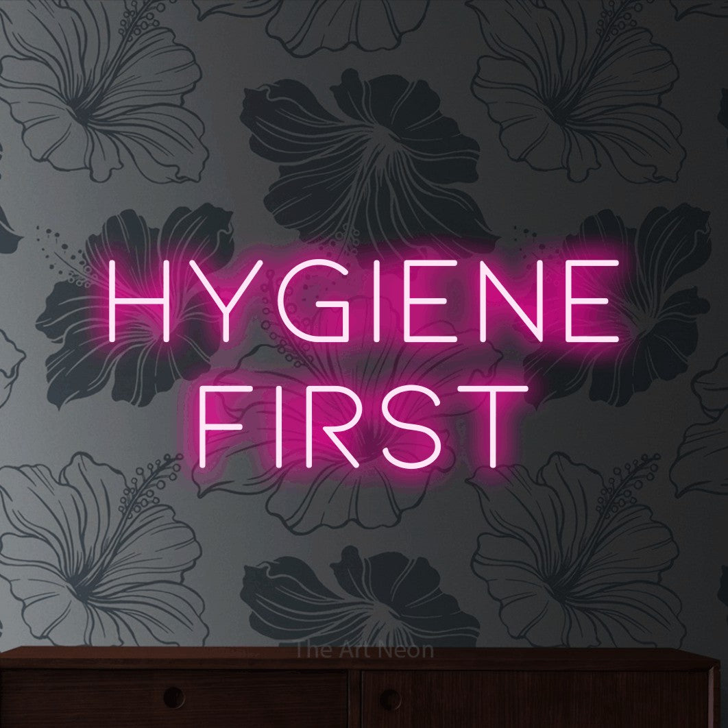 LED neon sign reading “HYGIENE first”, arranged in 2 lines.