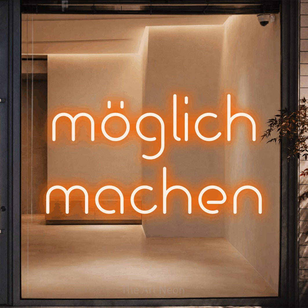 LED neon sign reading “möglich machen”, arranged in 2 lines.