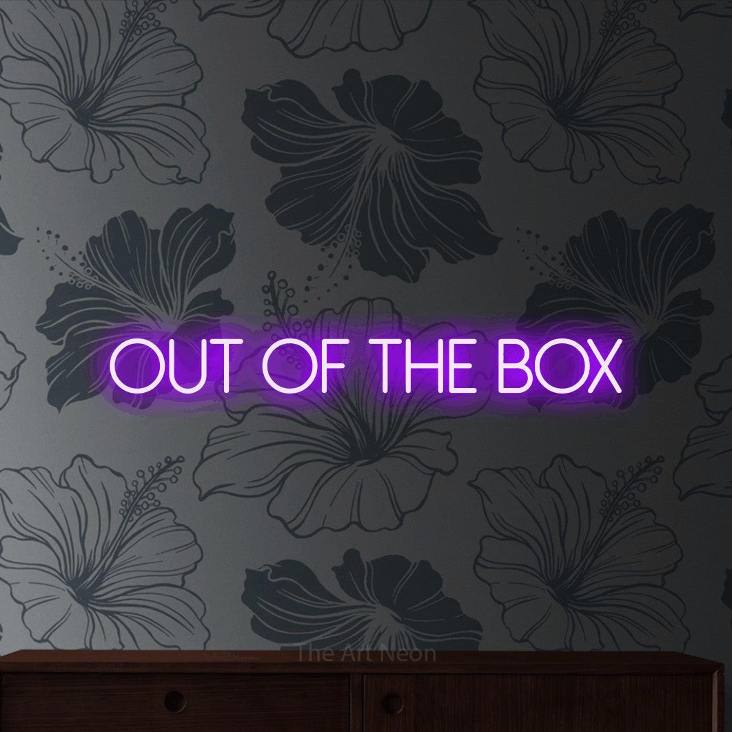 LED neon sign reading “Out of the box”, arranged in a single line.