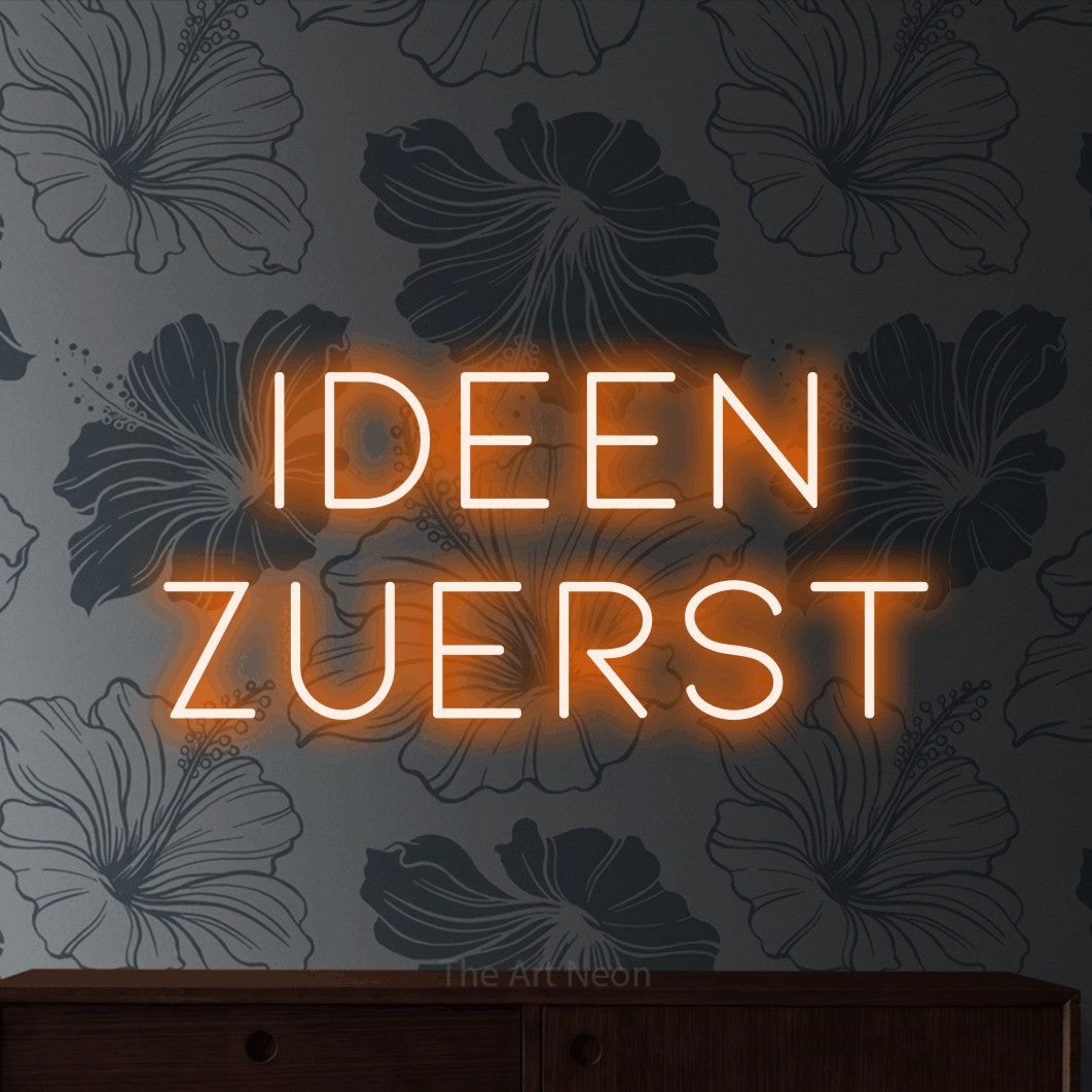 LED neon sign reading “Ideen zuerst”, arranged in 2 lines.