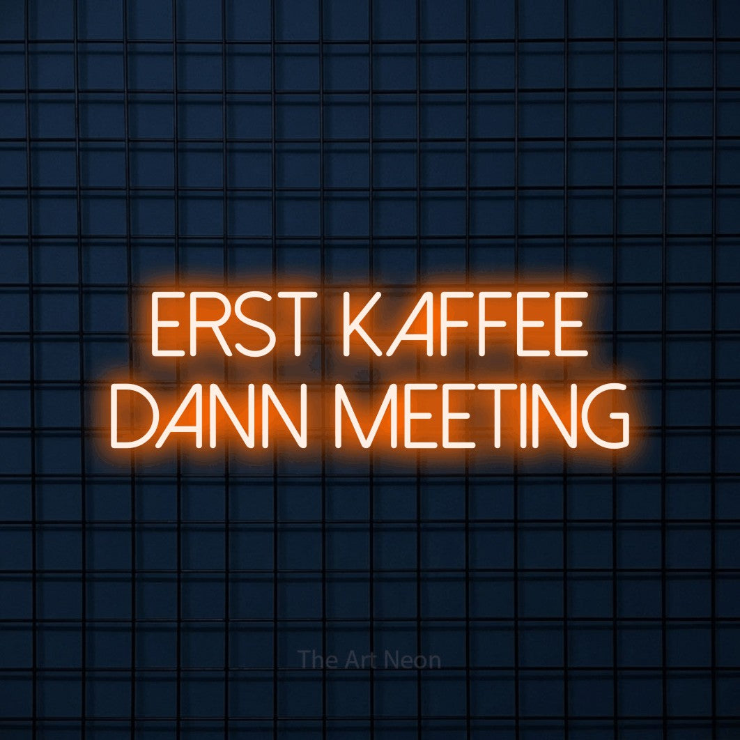 LED neon sign reading “ERST KAFFEE DANN MEETING”, arranged in 2 lines.
