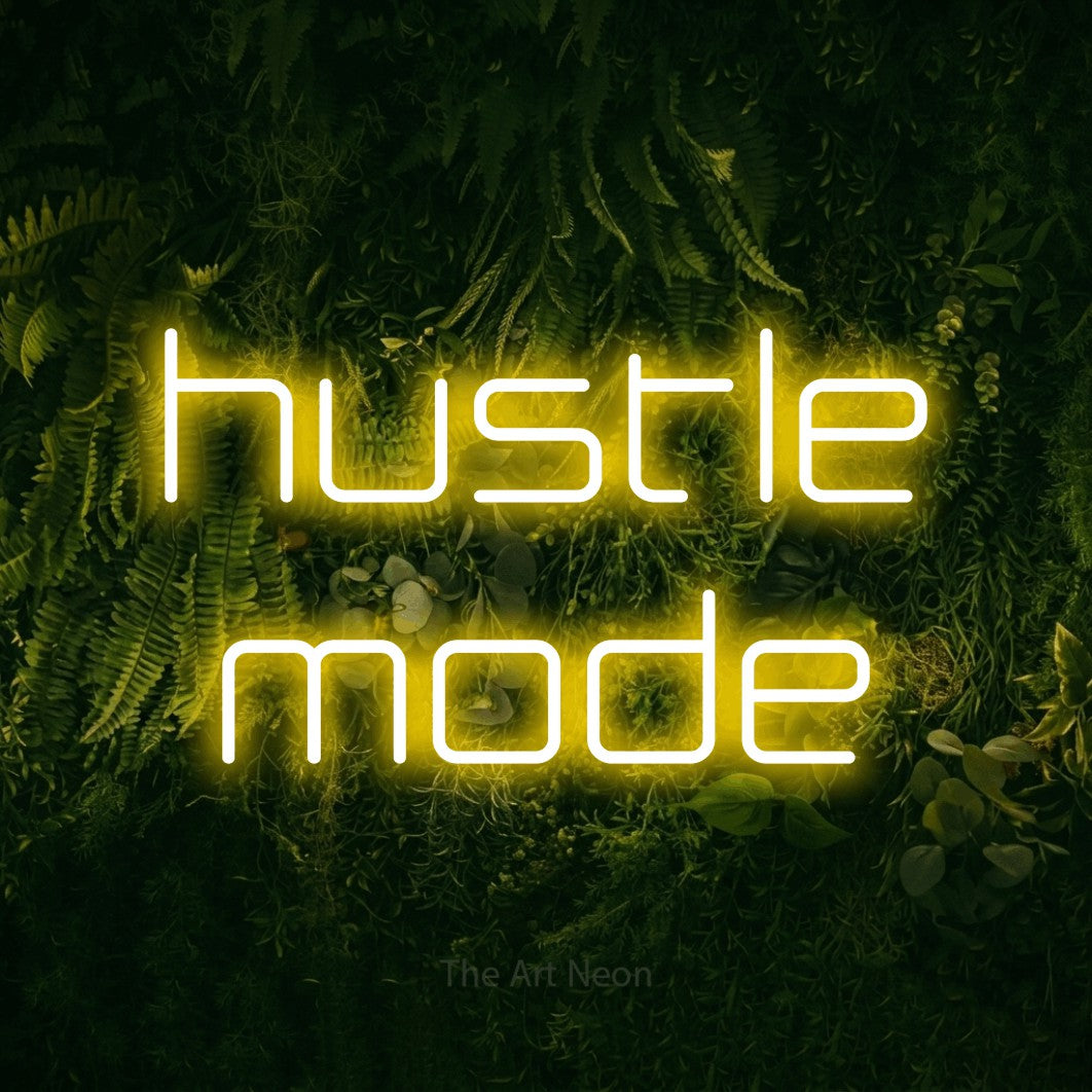 LED neon sign reading “hustle mode”, arranged in 2 lines.