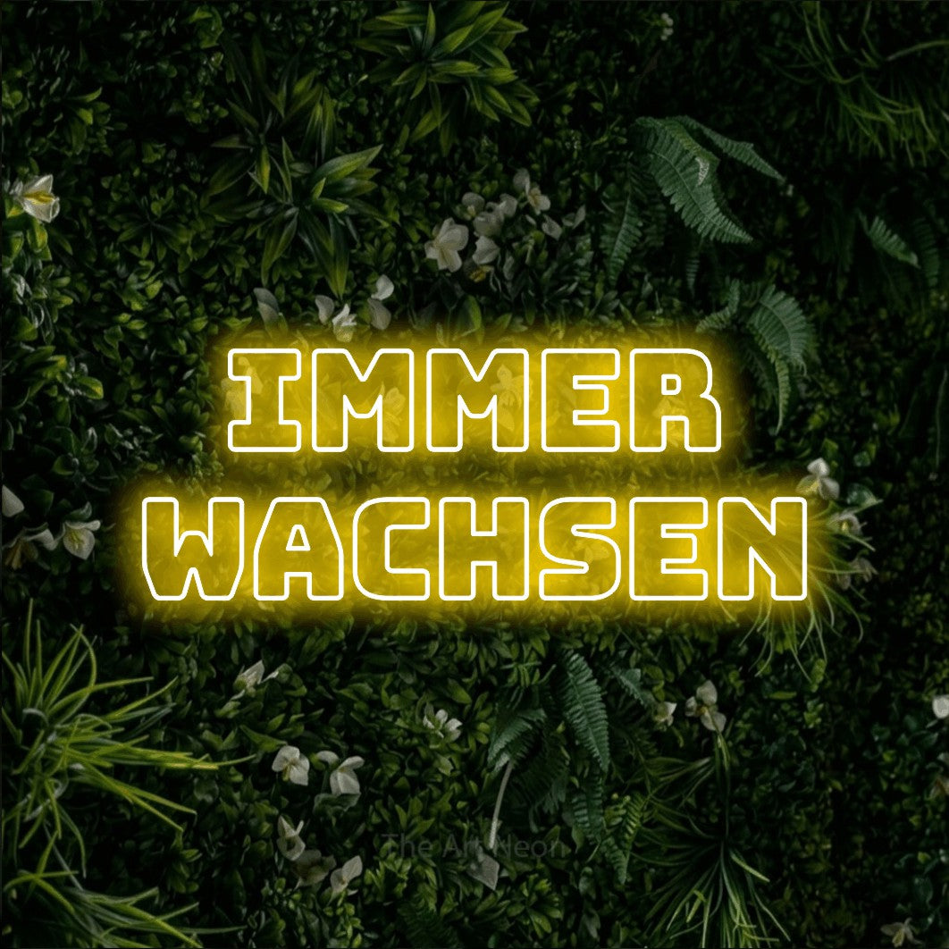 LED neon sign reading “Immer wachsen”, arranged in 2 lines.