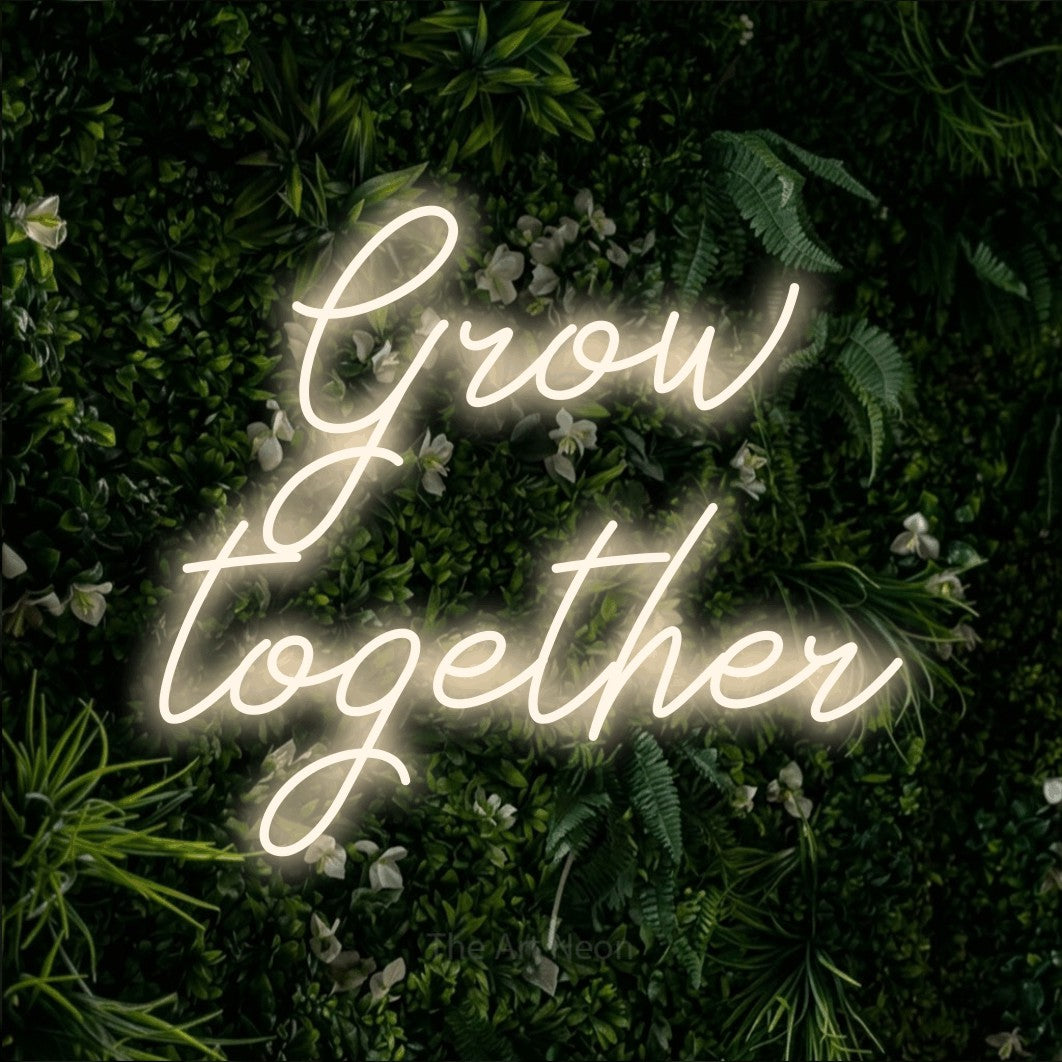 LED neon sign reading “Grow together”, arranged in 2 lines.